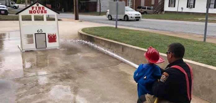 fire hose-Martinsville Fire & EMS-boy with fire hose-permission