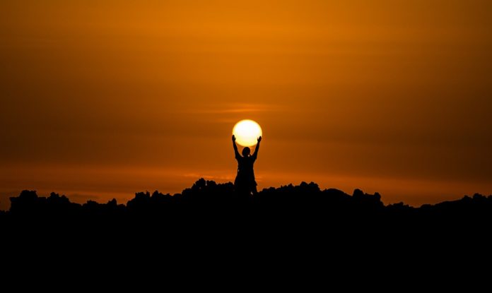 Person Holding Sunset Silhouette Shadow-David Monje on Unsplash via Ohio State University