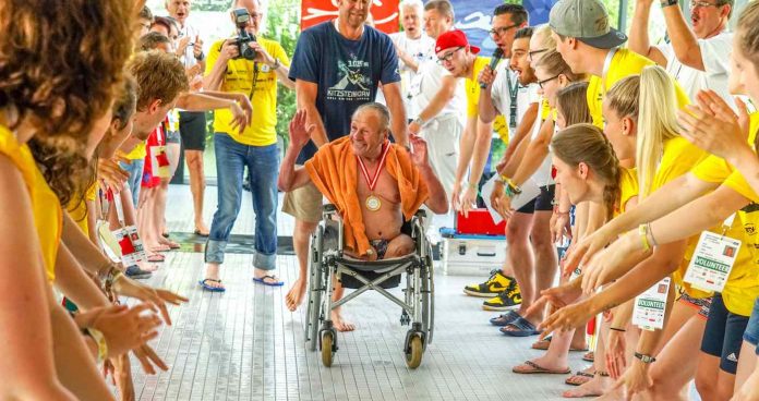 Special Olympics-swimmer-in-wheelchair-medal-winner-public-domain