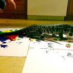 Giant Lizard Raises Money for Bushfire Relief by Painting Massive Artworks With His Claws