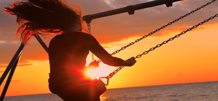 girl woman swinging fun play-swingset-pubdomain-Noah Silliman