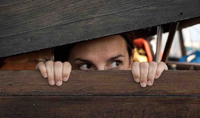 Woman Hiding in Fear or Playing Hide and Seek-Public Domain via Libreshot