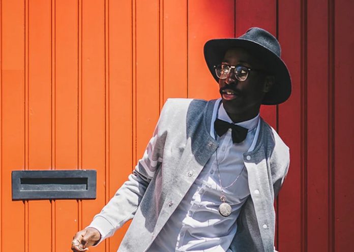 black man bowtie style fashion orange wall-pubdomain-Clem Onojeghuo