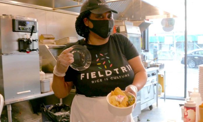Masked Restaurant Worker Smiling-World Central Kitchen WCK Youtube Screenshot