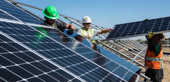 solar panels energy workers hardhats-pubdomain-Science in HD
