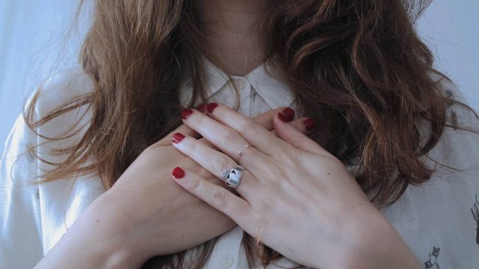 woman with hands over heart-pubdomain-Giulia Bertelli