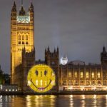 Company Projects Smiley Face On London’s Parliament Across From A Hospital