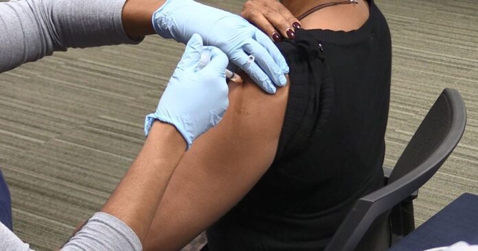 woman getting flu shot-Am Heart Assoc released