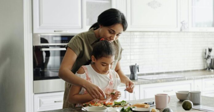 Mom and daughter cook food kitchen-submitted-By Zoya Gervis-SWNS