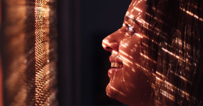 woman in light window inspiring future gaze optimism pubdomain Dollar Gill