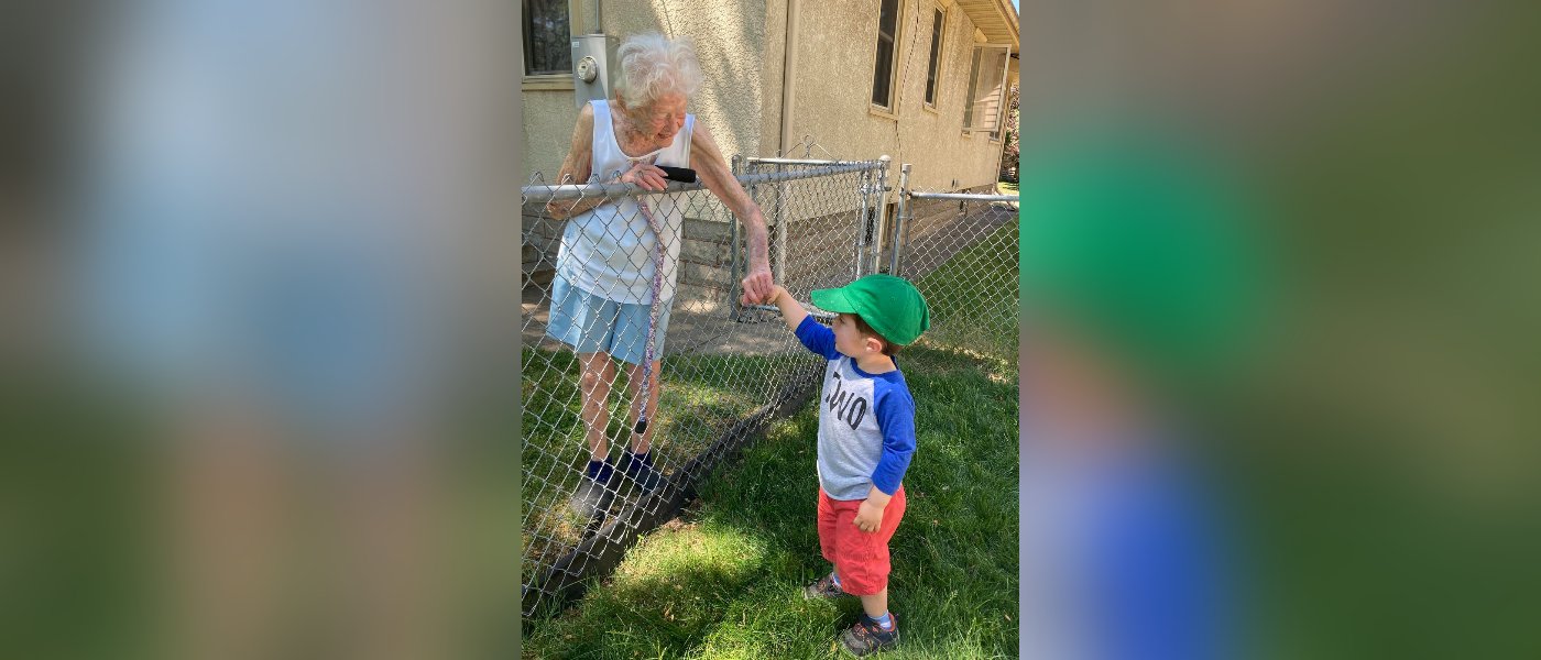 Little Boy Finds Real Friendship With 99-Year-old Woman Over the Fence During Lockdown