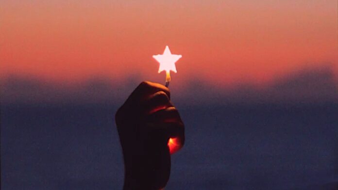 hand holds star light hope-pubdomain Aziz Acharki