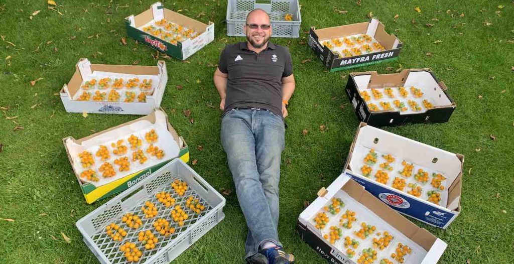 Douglas Smith with yellow cherry tomatoes SWNS