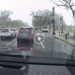 Watch the Moment a Guy Jumps Out of His Car to Give Umbrella to Couple Stuck in D.C. Downpour