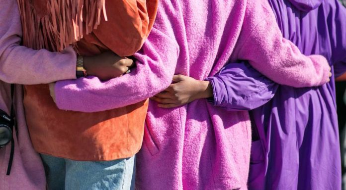 arm in arm multi racial girl friends together strength community-pubdomain-Vonecia Carswell