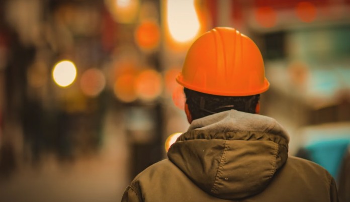 Labor union worker w hard hat in factory-pubdomain Jon Tyson