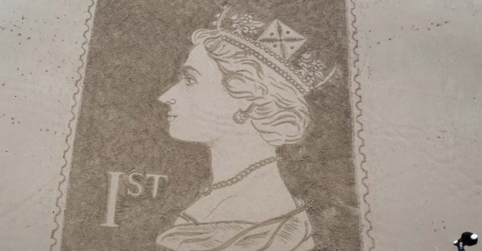 cropped Queen Elizabeth portrait in sand-swns