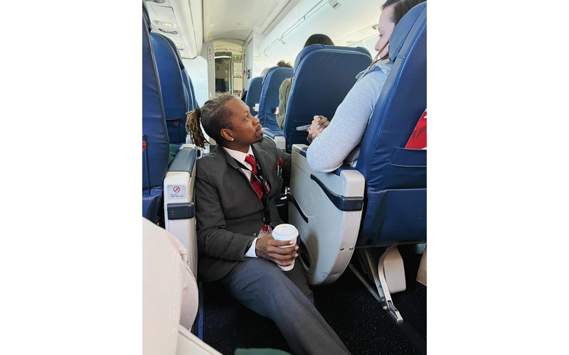 Delta Flight Attendant Consoles Fearful Passenger and Photo Goes Viral