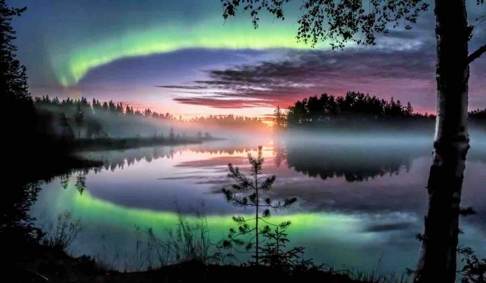 Northern Lights aurora reflection on lake-released by-Visit Finland-Asko Kuittinen