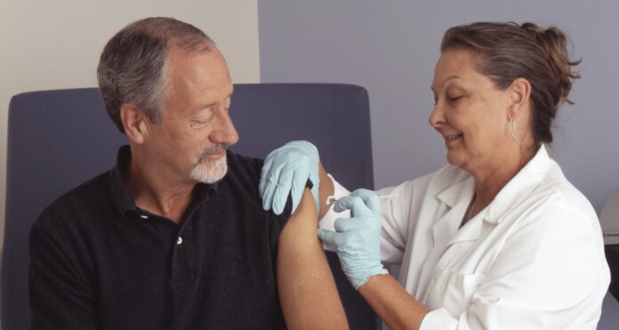 man receiving shot or medicine from doctor nurse-pubdomain National Cancer Institute