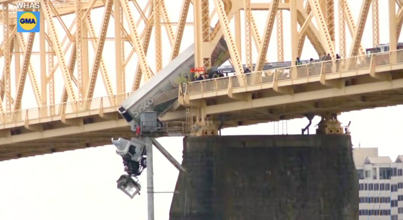 Hero Firefighters Rescue Driver Trapped in Semi-Truck Dangling Off Bridge (LOOK)