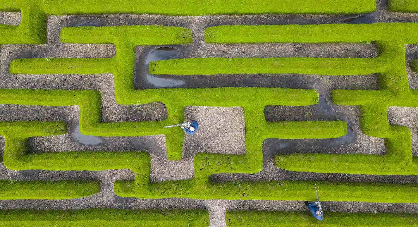 Mesmerizing Photo Shows Gardeners Perfecting a Maze at 625-Year-old British Castle