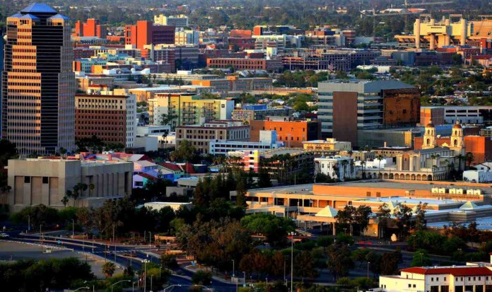 The downtown section of Tucson just before sunset, viewed from Sentenal Peak - Bill Morrow, CC 2.0. BY-SA
