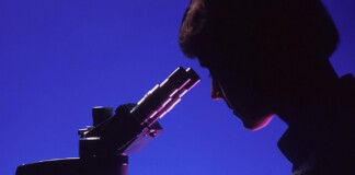 woman scientist microscope research lab test-pubdomain National Cancer Institute