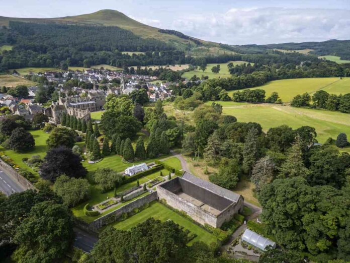 Falkland Palace Royal Tennis Court, with the town of Falkland in the background - credit, SWNS.