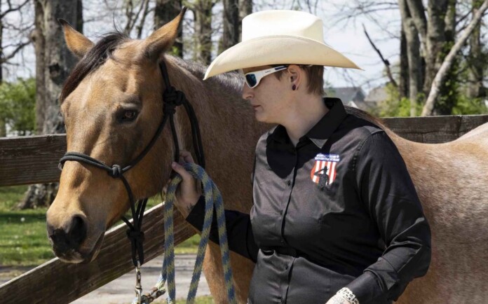 A veteran enrolled in the CERV program handles her horse - credit DoVA