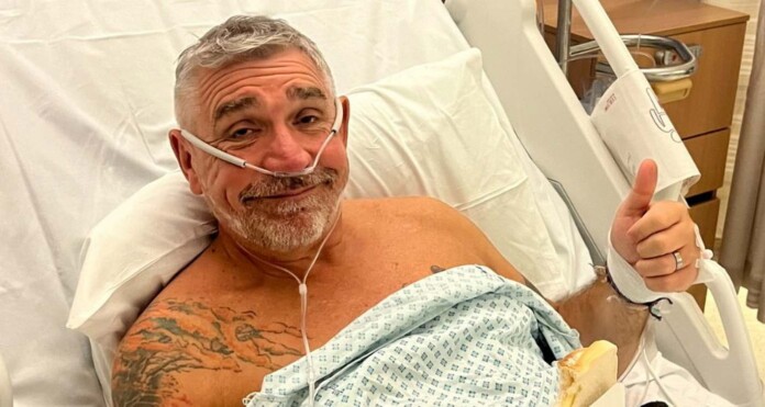 Andy Emmott in his hosptial bed on January 15th - credit, SWNS