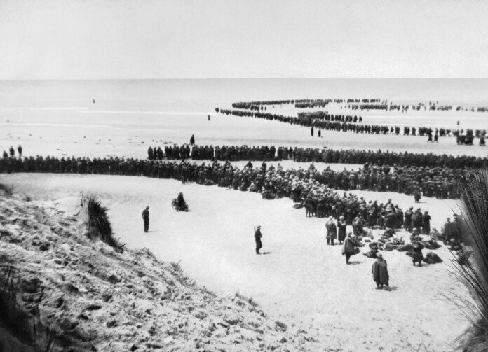 BEF and Allied forces que on the beaches of Dunkirk for evacuation