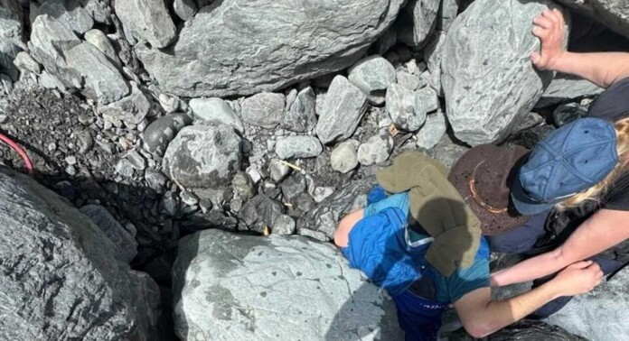 Kell Morris rescue from boulders -Jason Harrington for Seward Fire Department-released cropped