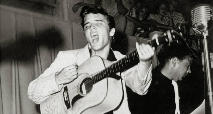 Elvis Presley in 1955 publicity photo w guitar now in public domain