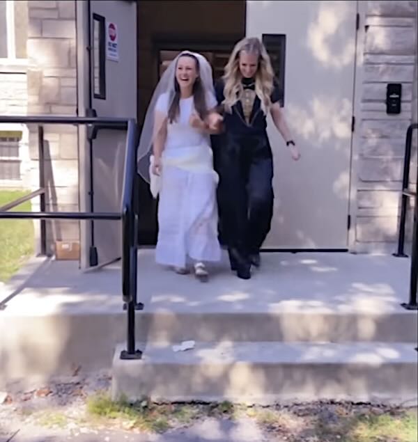 ‘Instant Tears’ For Principal Who Wanted Every Student At Her Wedding–So They Walk Her Down The Aisle At School (Watch)