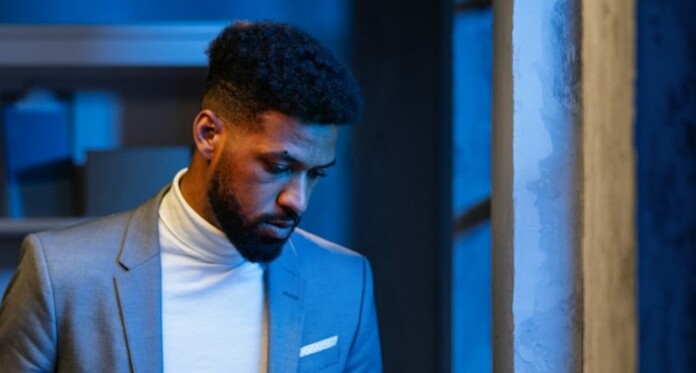 African-American Black business man reading sad by Getty Images For Unsplash+ JCWJ83HP76k