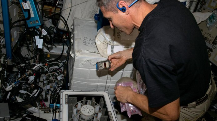 NASA Astronaut Michael Hopkins performing an asteroid mining experiment on board the ISS - credit, NASA via Cornell University - released