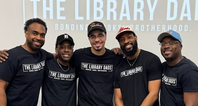 Khari Arnold-center-founded The Library Dads-courtesy