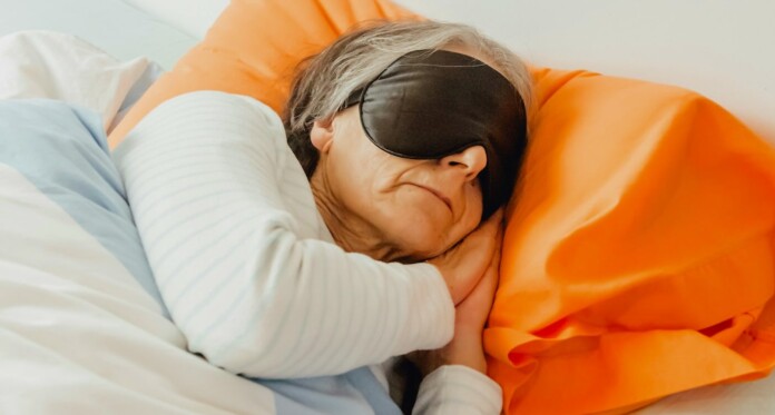 Senior sleeping old aging eye mask sick in bed by A C For Unsplash+ pZVOgkmBM0Y