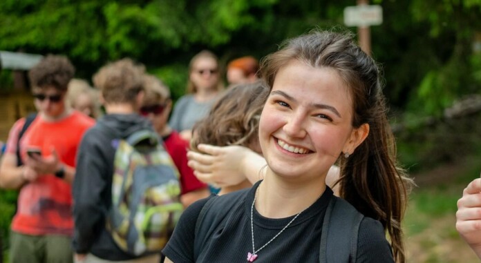 Woman girl camp counselor teens by Timur Shakerzianov uA0yYcZuH_U-unsplash