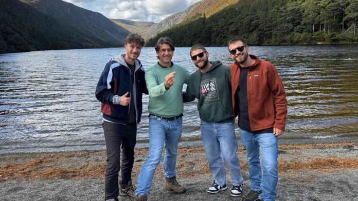 Irishman Patrick Mohr, second from left, holds up his wedding ring alongside the three Italian friends who found it - - provided to CBC by Patrick Mohr