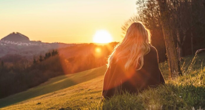 Woman sitting in nature meditate by Sara Kurfess-QyjwUq5Amp8-unsplash